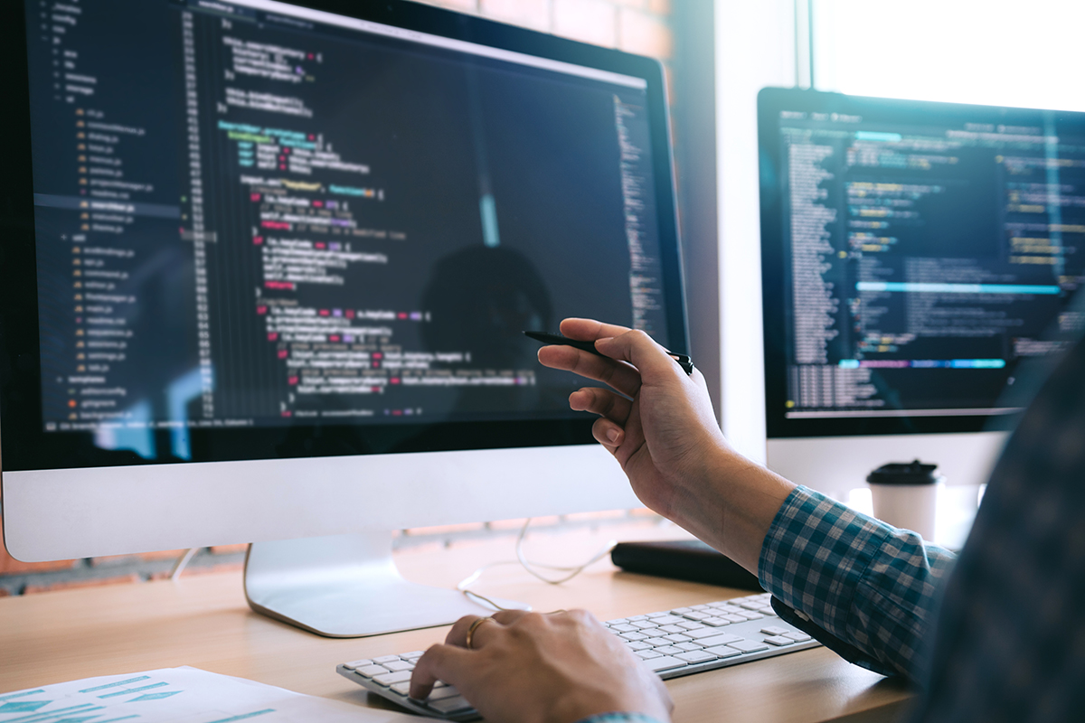 Software developer looking at code.